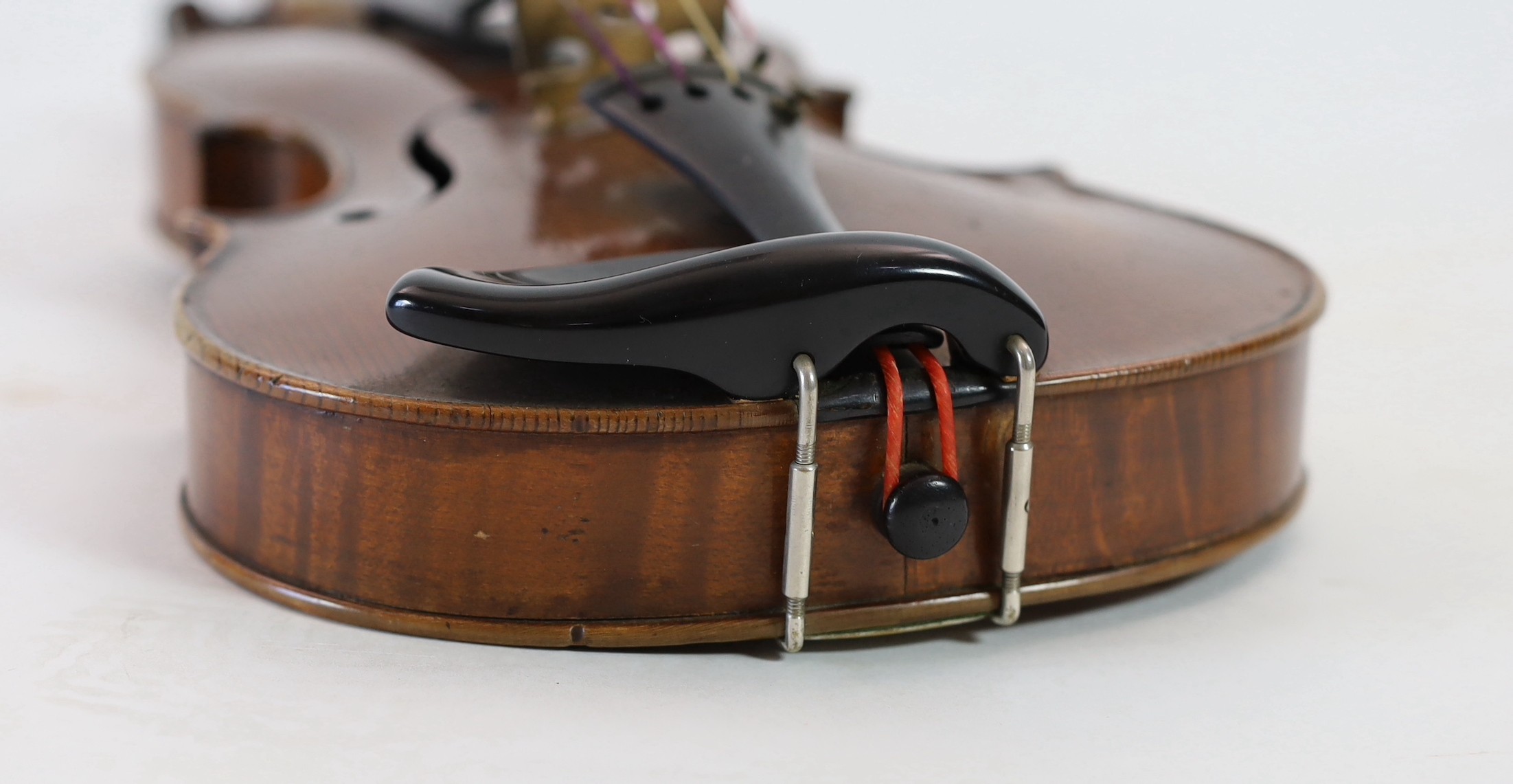 A violin, labelled Leandro Bisiach della Scuola Cremonese fece in Milano 1898, Piazzo del Duomo, length of back 35.6 cm (14in.) cased